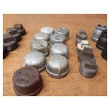 Lot of (39) Steel Pipe Fittings - (11) 1-1/4" Couplers, (2) 1-1/4" Unions, (6) 1-1/4" x 1" Reducers, (2) 1-1/4" x 1/2" Reducers, (5) 1-1/4" Plugs, (9) 1-1/4" Caps, (4) 1-1/2" Plugs