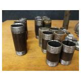 Lot of (35) Steel Pipe Fittings - (12) 2" Plugs, (5) 2" 45° Elbows, (6) 2" x 5-1/2" Nipples, (4) 2" x 4-1/2" Nipples, (2) 2" x 4" Nipples, (3) 2" x 5" Nipples, (2) 2" x 6" Nipples & (1) 2" x 10" Nipp