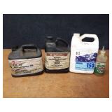 (3) Partial Jugs of Mineral Oil and Bottle of Vacuum Pump Oil