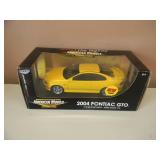 1/18 SCALE DIE-CAST - AMERICAN MUSCLE 2004 PONTIAC GTO. NEW IN BOX. GREAT PIECE - SEE PICTURES.