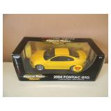 1/18 SCALE DIE-CAST - AMERICAN MUSCLE 2004 PONTIAC GTO. NEW IN BOX. GREAT PIECE - SEE PICTURES.