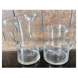 2 Clear Glass Pitchers