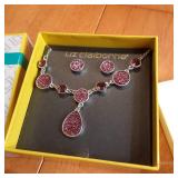 Silver toned necklace and earring s...