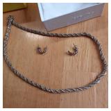 Silver toned necklace and earring s...