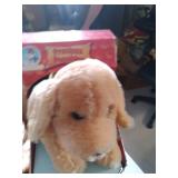 New in package animated and vocal puppy as well as other stuffed toys to add to your collection