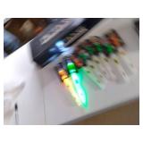 Pictionary, puzzles, Yu-Gi-Oh! storage tin and a handful of Lifegear flashlight/glow stick combos