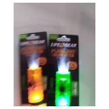 Pictionary, puzzles, Yu-Gi-Oh! storage tin and a handful of Lifegear flashlight/glow stick combos