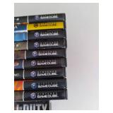 Stack of assorted Nintendo Gamecube video games.