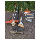 Lot of Cleaning Tools: Brooms, Mops, And More.
