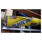 A Bucket Filled With Miscellaneous Items--Warps Carry Home Plastic Sheeting