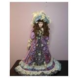 Lovely China Doll in Fancy Dress on a Stand