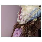 Lovely China Doll in Fancy Dress on a Stand
