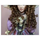 Lovely China Doll in Fancy Dress on a Stand
