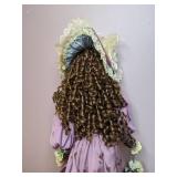 Lovely China Doll in Fancy Dress on a Stand