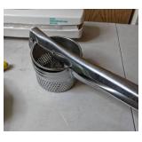 Kitchen Items: Meat Grinder, Potato Ricer, and Saran Wrap Holder