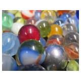 CROWN BAG FULL OF VINTAGE MARBLES.