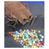 FRINGED LEATHER POUCH OF VINTAGE MARBLES