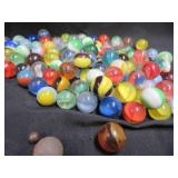 FRINGED LEATHER POUCH OF VINTAGE MARBLES