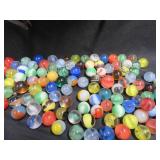 FRINGED LEATHER POUCH OF VINTAGE MARBLES