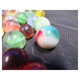 FRINGED LEATHER POUCH OF VINTAGE MARBLES
