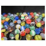 FRINGED LEATHER POUCH OF VINTAGE MARBLES