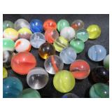 FRINGED LEATHER POUCH OF VINTAGE MARBLES