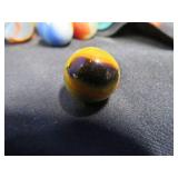FRINGED LEATHER POUCH OF VINTAGE MARBLES