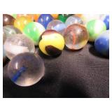 FRINGED LEATHER POUCH OF VINTAGE MARBLES