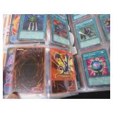 LARGE BOOK FILLED WITH YU-GI-OH / MISC. COLLECTABLE CARDS.