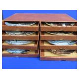 8 NUMBERED COLLECTOR PLATES IN SEPARATE DRAWERED CASE.
