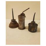 Three Old Oil Cans
