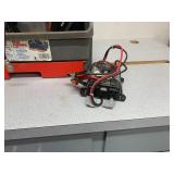 small Inverter and looks to me like a winch control and plug wires