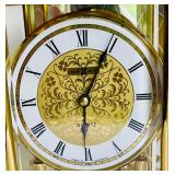 Brilliant Brass Howard Miller Clock with Etched Glass Accents