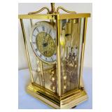 Brilliant Brass Howard Miller Clock with Etched Glass Accents
