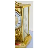Brilliant Brass Howard Miller Clock with Etched Glass Accents