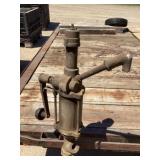 Vintage cast iron hand crank oil pump