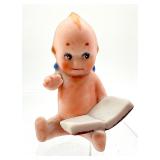 Antique Kewpie Doll Holding a Book