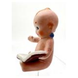 Antique Kewpie Doll Holding a Book