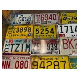 Board Full of Motorcycle License Plates from Assorted States