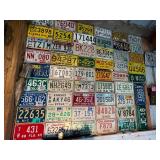 Board Full of Motorcycle License Plates from Assorted States
