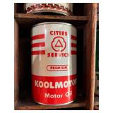 All Oil Cans Pictured in Cabinet