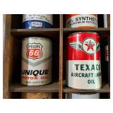 All Oil Cans Pictured in Cabinet