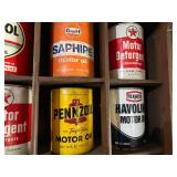 All Oil Cans Pictured in Cabinet