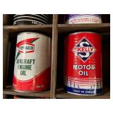 All Oil Cans Pictured in Cabinet