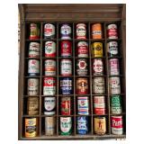 All Oil Cans Pictured in Cabinet