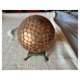 Globe Covered in US Pennies on Base
