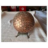 Globe Covered in US Pennies on Base