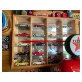 Display Cabinet Full of Various Year Corvettes