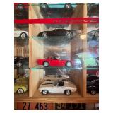 Display Cabinet Full of Various Year Corvettes