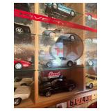 Display Cabinet Full of Various Year Corvettes
